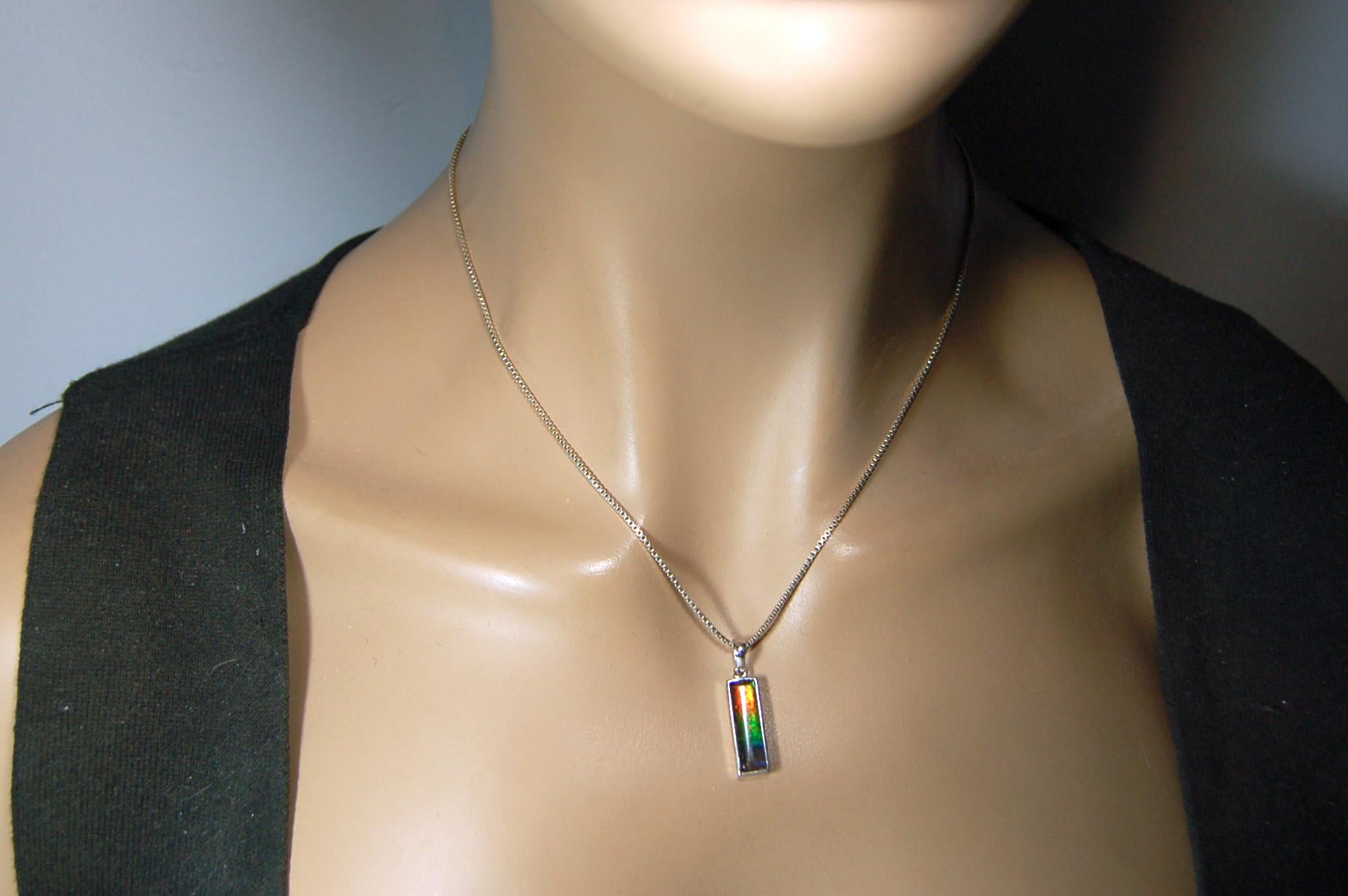 Lovely Ammolite pendant - the perfect gift for someone special.Sterling Silver plated with Rhodium so allergy free.052415