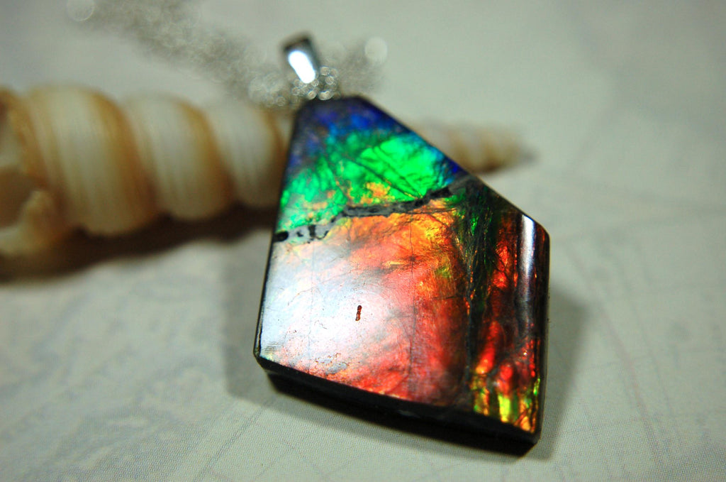 Ammolite pendant necklace.Unique raw natural cabochon with brilliant varied colors.Unisex design.Boho jewelry.031716