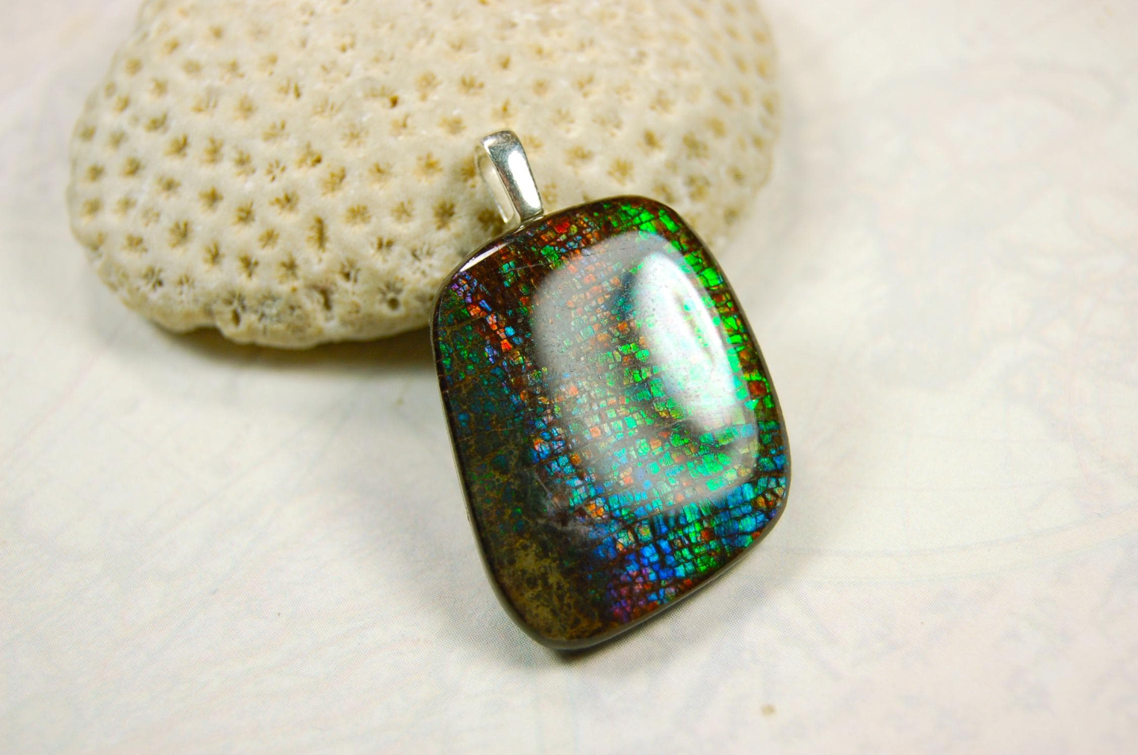 Ammolite Pendant Necklace.RARE Natural gem with brilliant sparks of color on black background.--071815