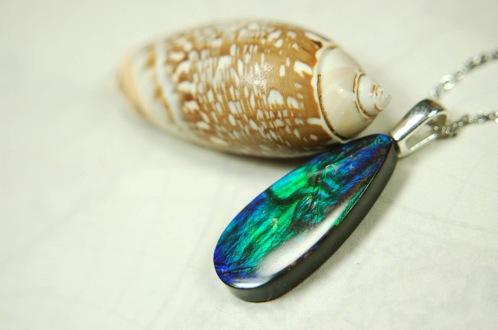 Ammolite Jewelry Pendant.All natural high quality cabochon from Alberta Canada.070715