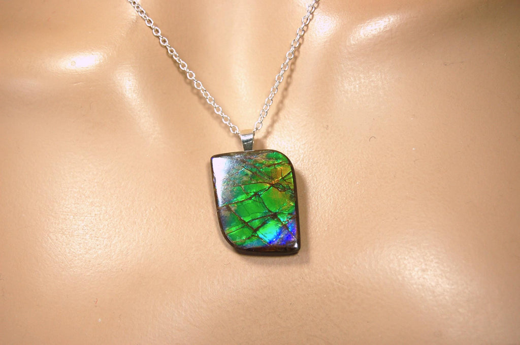 Ammolite Jewelry Pendant.Very high quality colors best seen in video.All natural cabochon gemstone from Alberta,Canada.031916