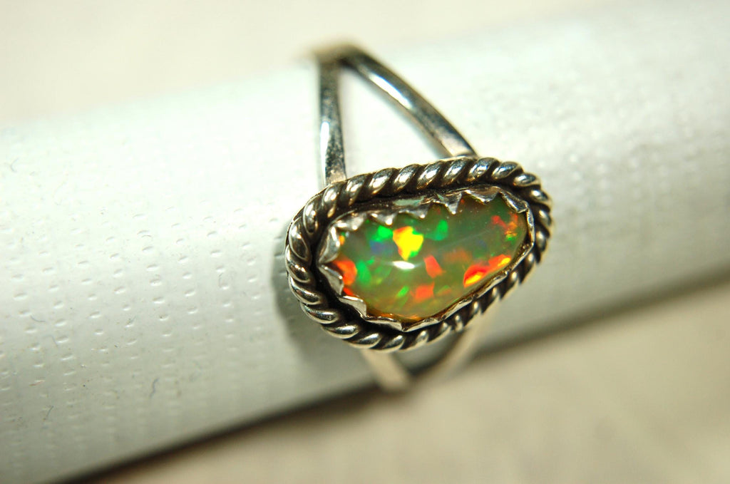Opal Ring.Genuine untreated Ethiopian Opal.Lovely bright colors when rotated.Size 8.Sterling Silver.053115