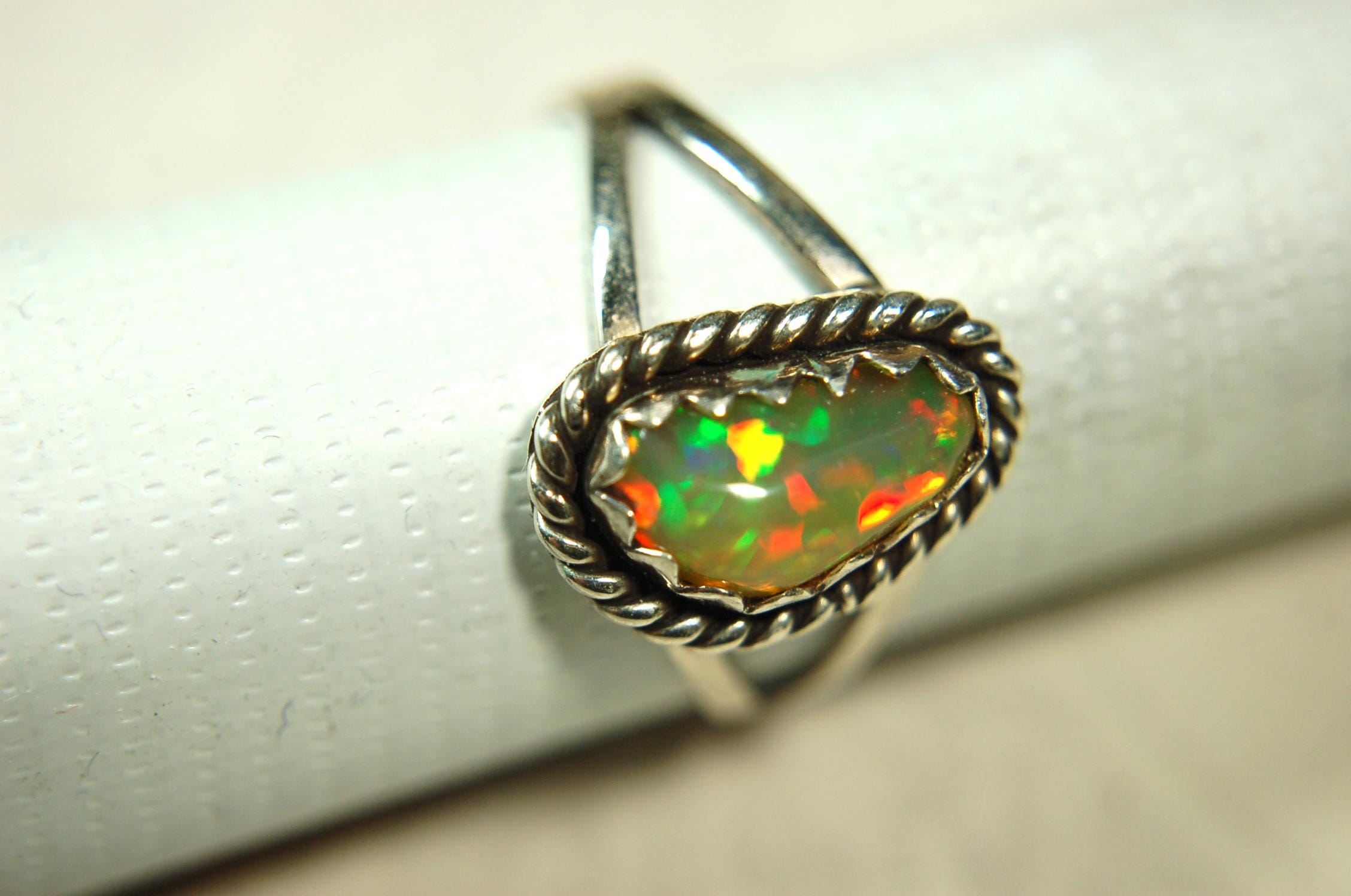 Opal Ring.Genuine untreated Ethiopian Opal.Lovely bright colors when rotated.Size 8.Sterling Silver.053115