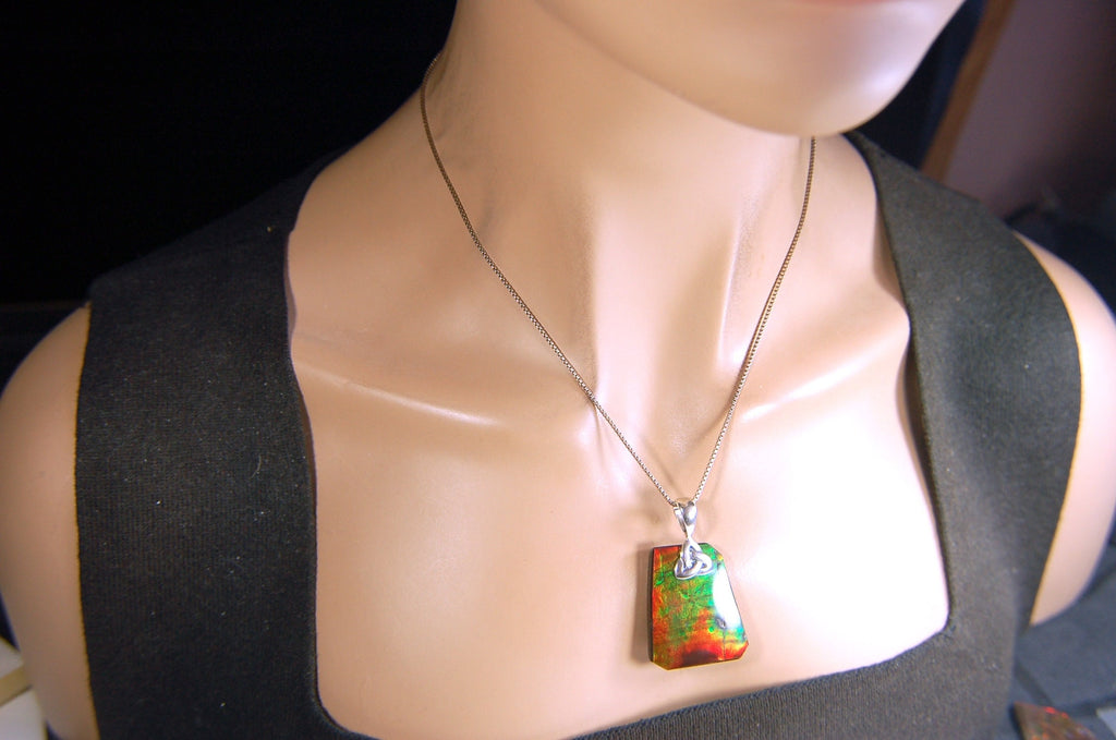 Natural Ammolite Cabochon Pendant necklace with deep rich colors.Heavy sterling silver Celtic Bail.Gift for wife? Must see video.032514