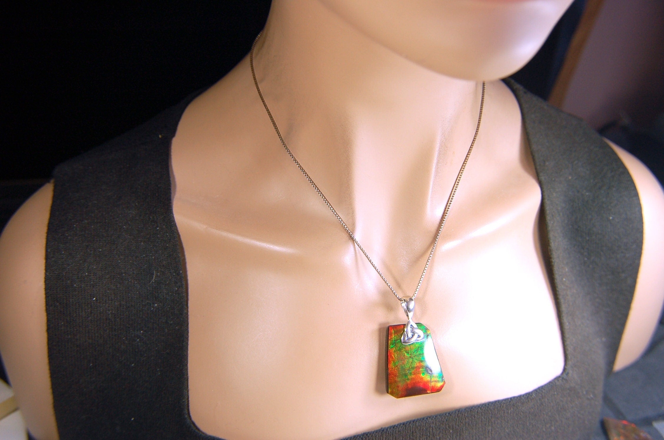 Natural Ammolite Cabochon Pendant necklace with deep rich colors.Heavy sterling silver Celtic Bail.Gift for wife? Must see video.032514