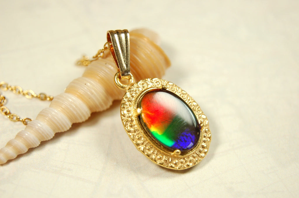 Genuine rainbow Ammolite pendant in 14k gold fill setting.#070414