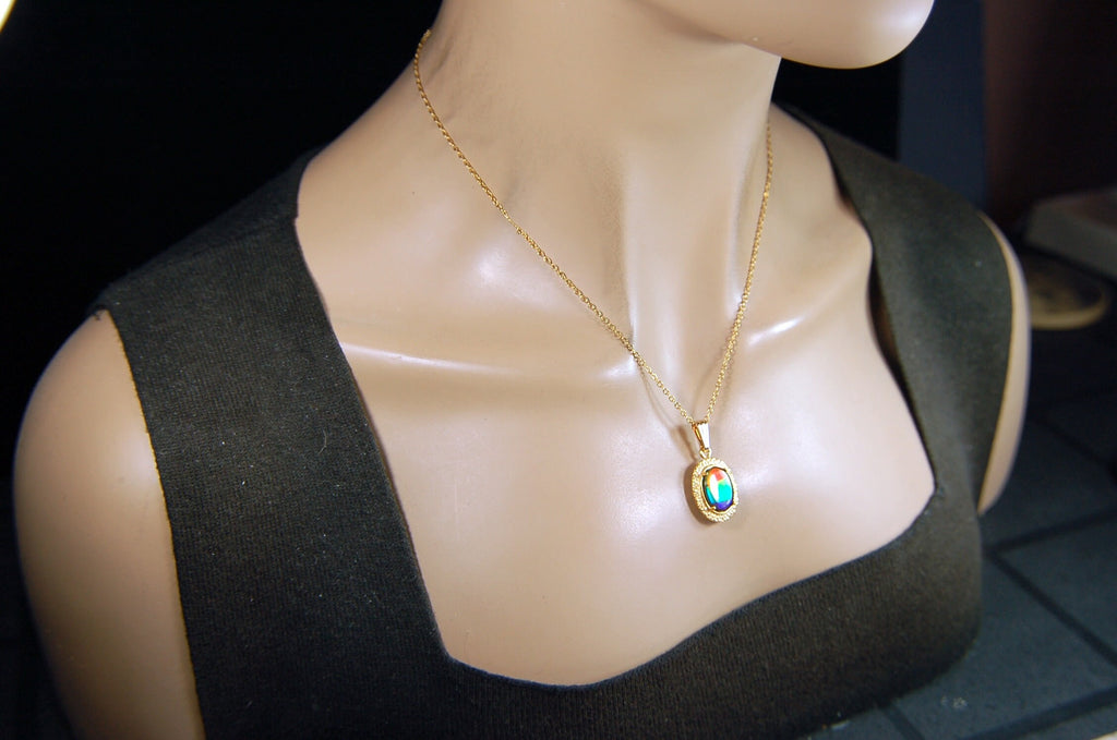 Genuine rainbow Ammolite pendant in 14k gold fill setting.#070414