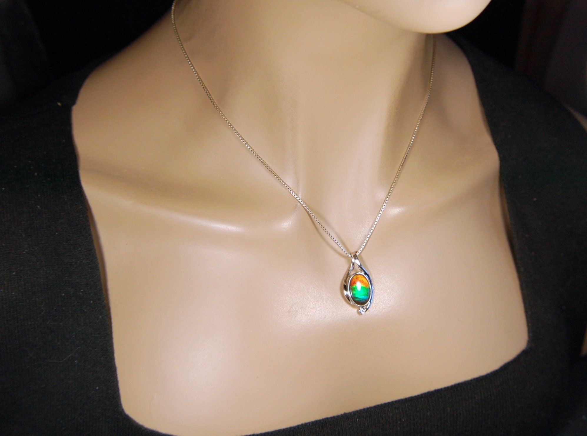 Ammolite Jewelry Pendant.Strong colors.Quality sterling Allergy free silver setting.Shipped free.071612