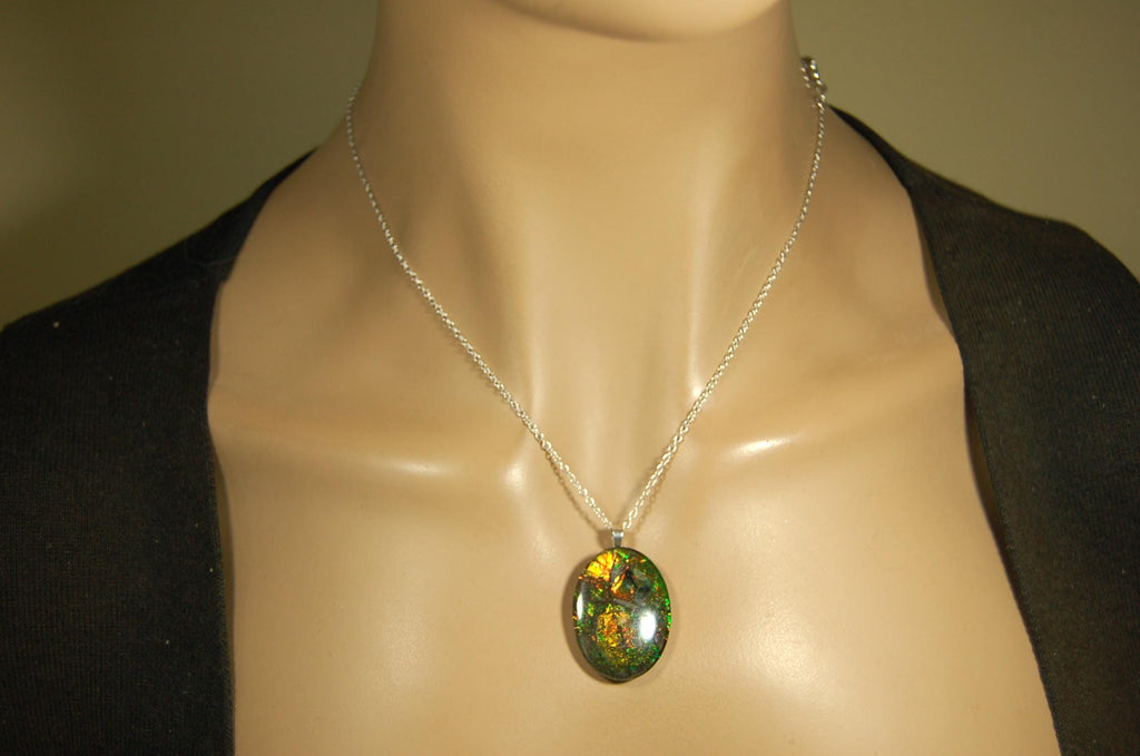 Ammolite cabochon pendant to upgrade your fashion accessory collection.Green and Copper colors.Sterling silver bail.Birthday gift? 032716