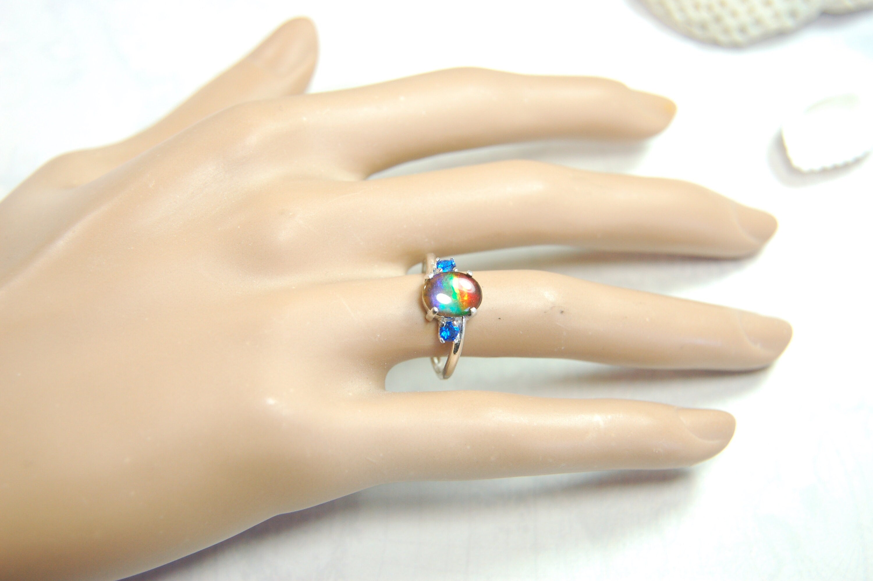 Ammolite Ring with brilliant Spinel side stones.Size 7.