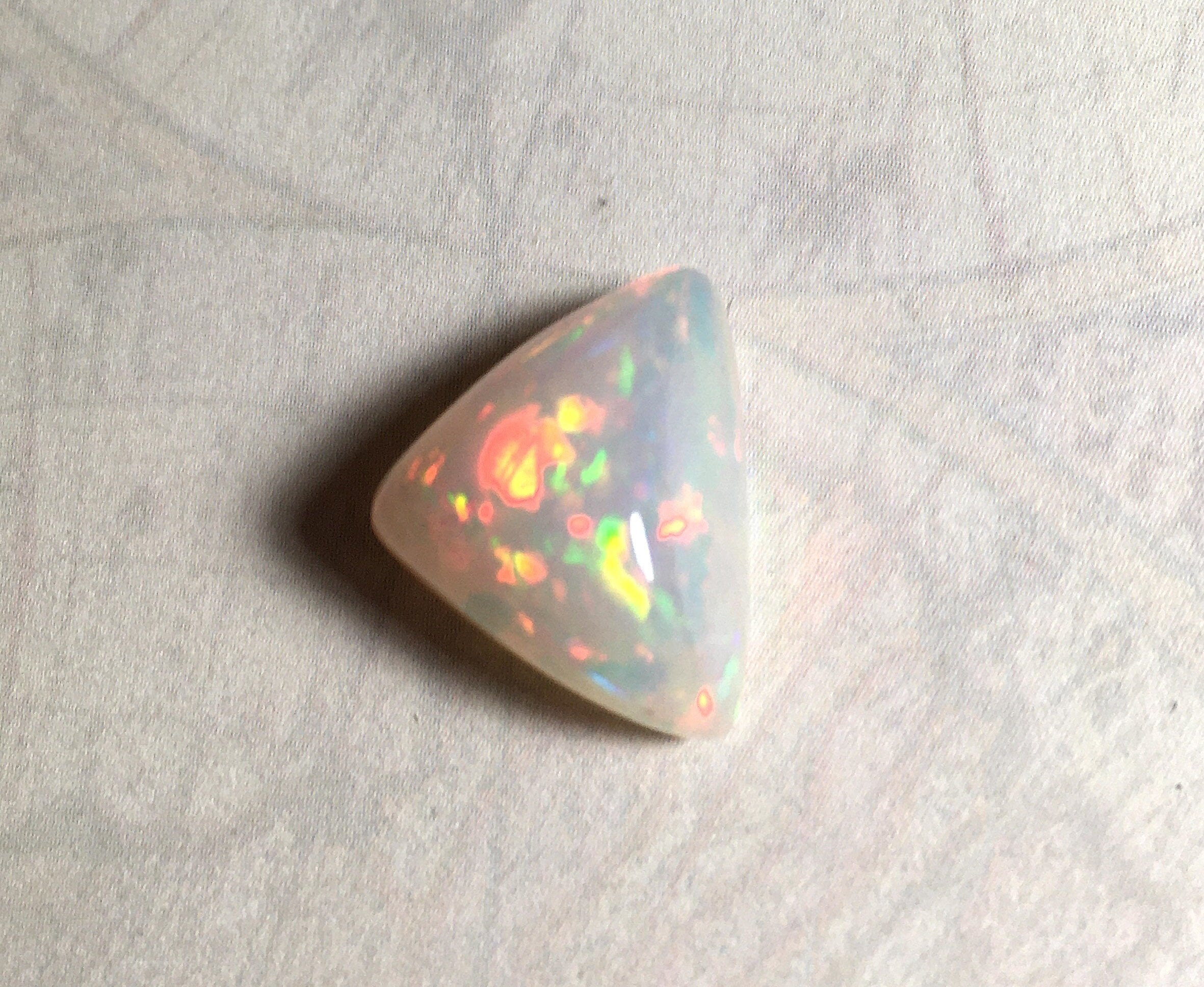 Large genuine natural Opal Cabochon from Ethiopia.11 Carat beauty with many bright colors.Best viewed in video--better in hand.122813