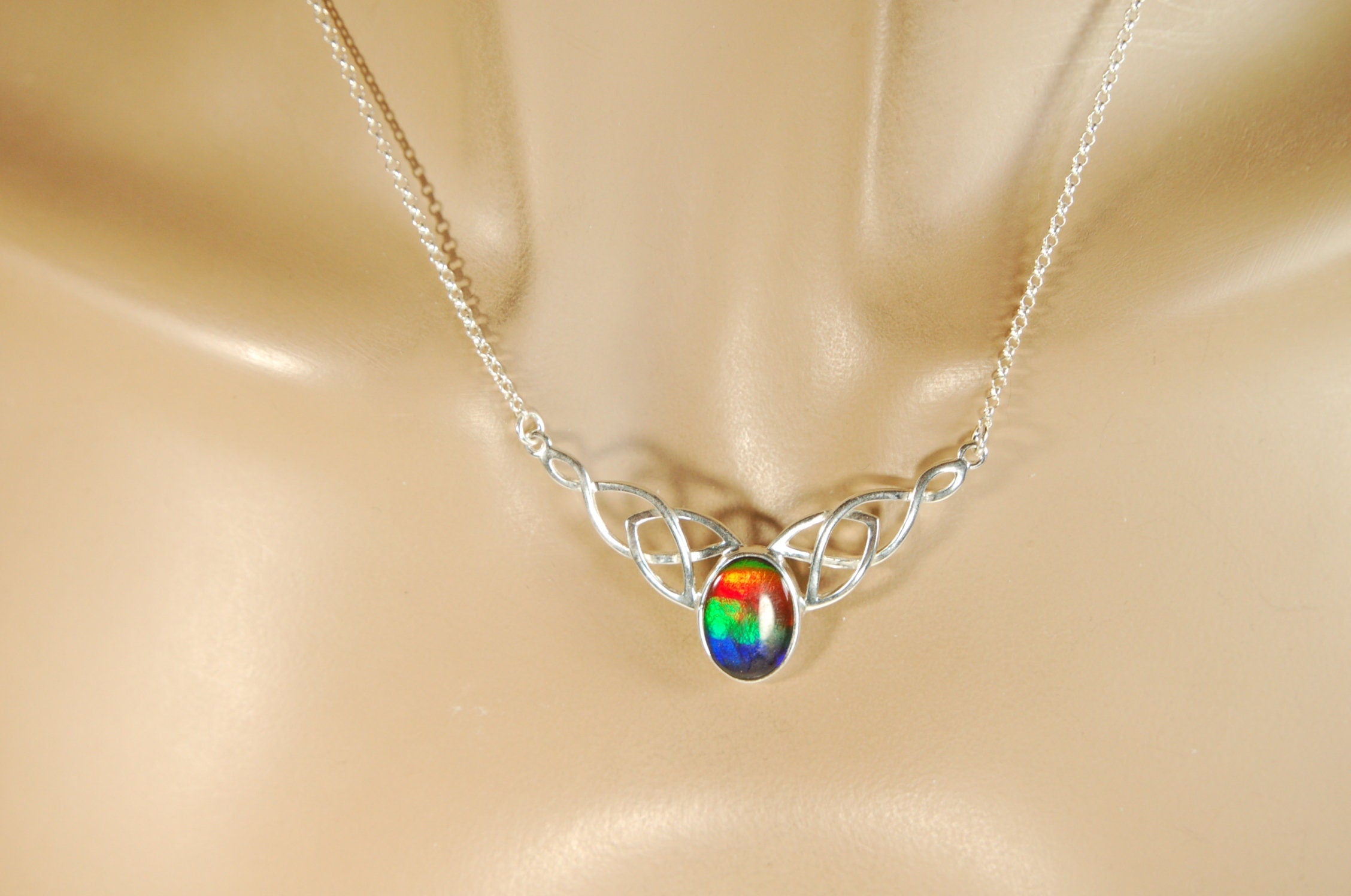 Ammolite Jewelry Necklace of the much admired Rainbow type.Four colors. Lovely Celtic setting with extender.#042513