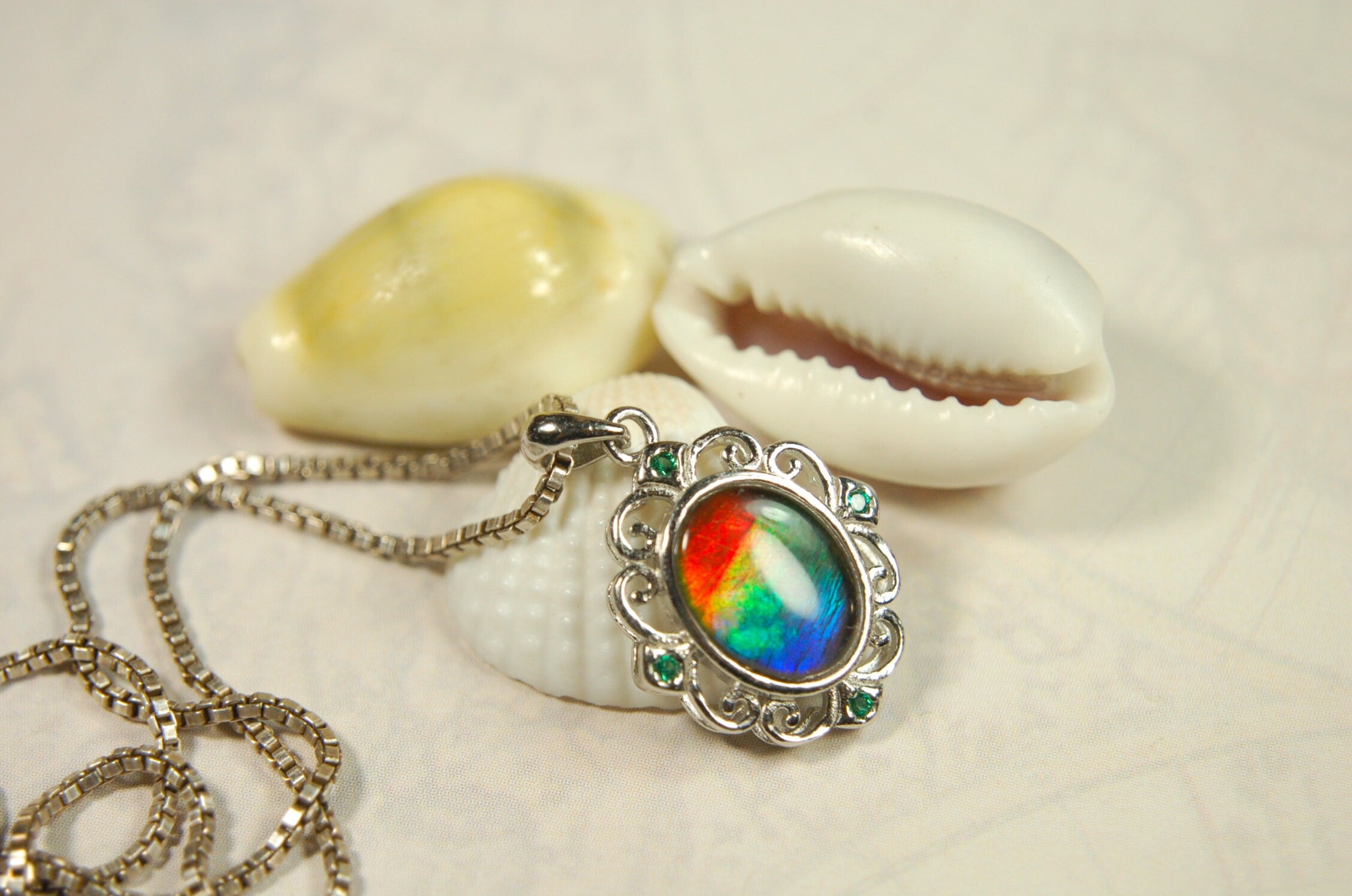 Ammolite Jewelry Pendant.Certified Authentic Canadian gem.White Gold Fill over Sterling silver setting.120213