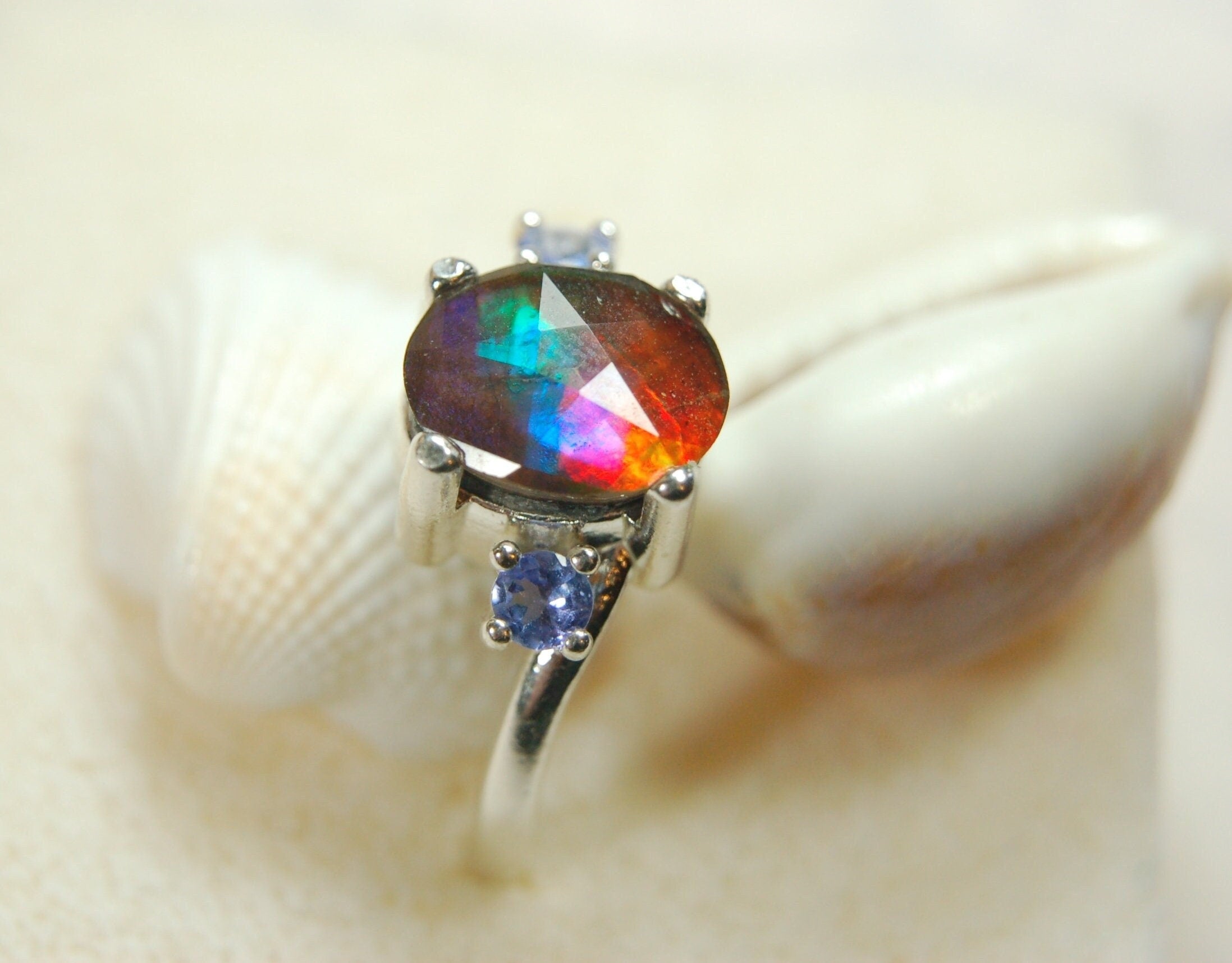 Ammolite Jewelry Ring with Tanzanites.No import taxes under CUSMA rules.022414