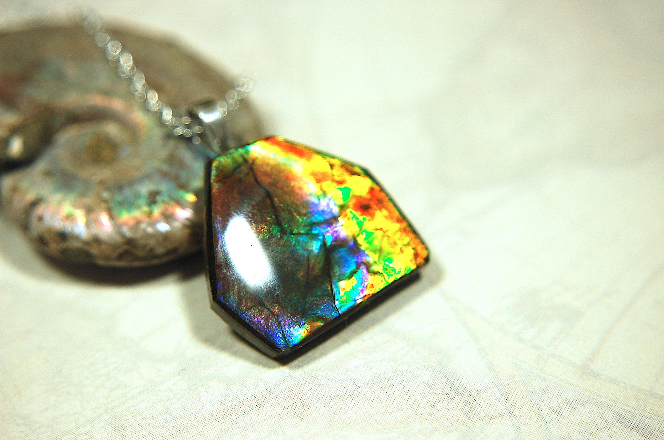Ammolite pendant.RARE colors.Best seen in video.All natural cabochon from Alberta Canada.Thoughtful gift for her.022716
