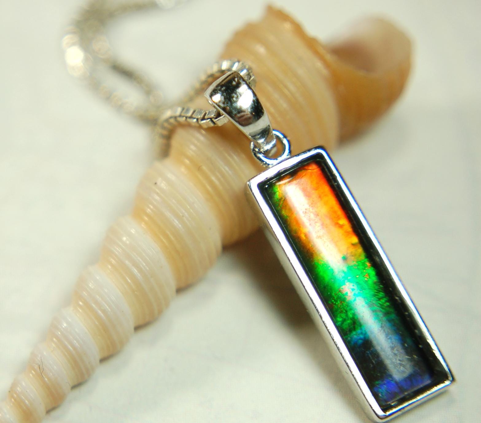Lovely Ammolite pendant - the perfect gift for someone special.Sterling Silver plated with Rhodium so allergy free.052415
