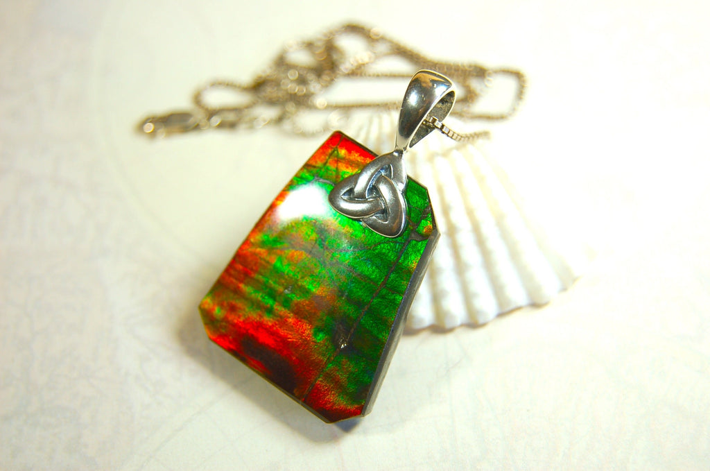 Natural Ammolite Cabochon Pendant necklace with deep rich colors.Heavy sterling silver Celtic Bail.Gift for wife? Must see video.032514