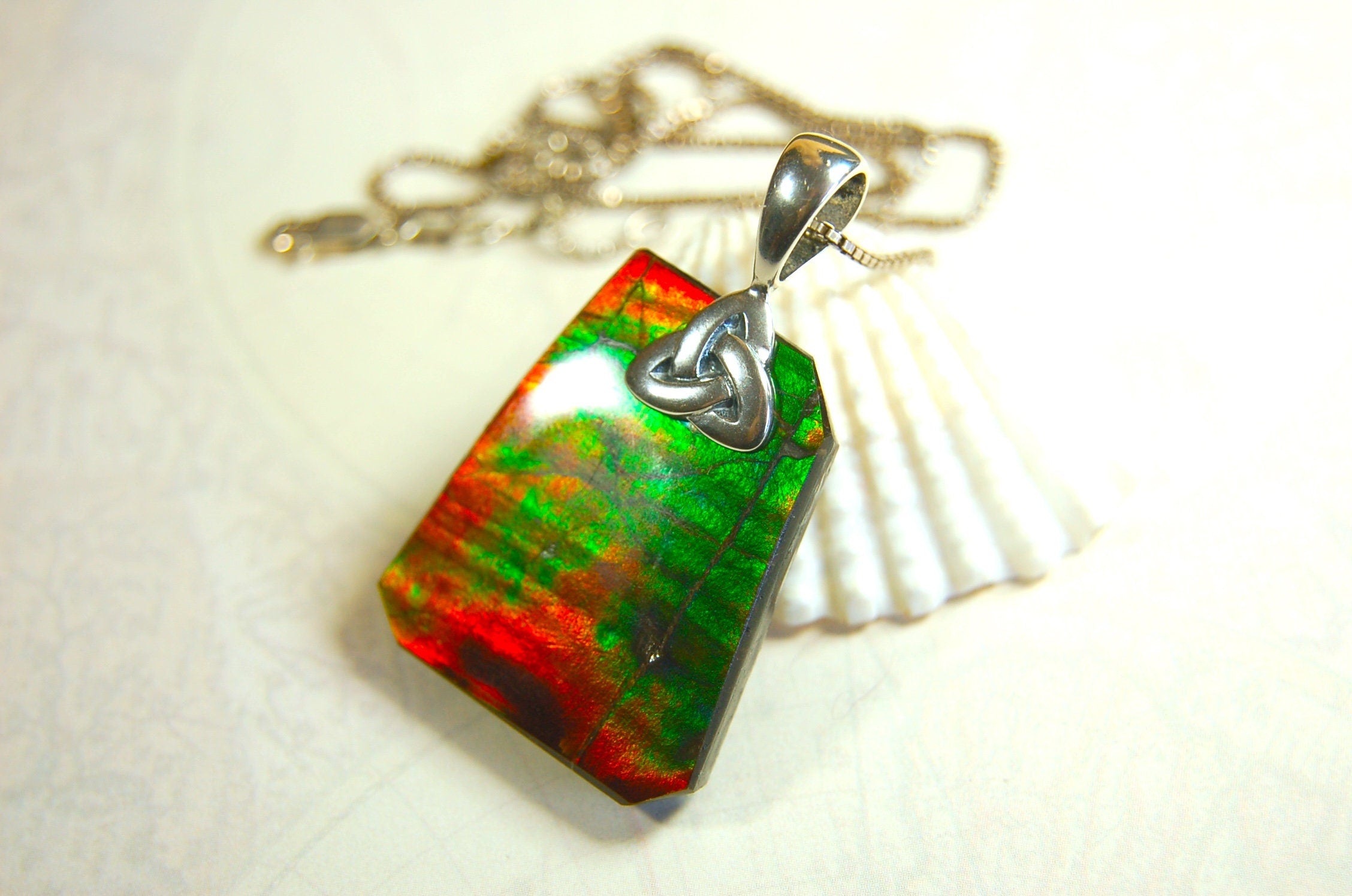 Natural Ammolite Cabochon Pendant necklace with deep rich colors.Heavy sterling silver Celtic Bail.Gift for wife? Must see video.032514