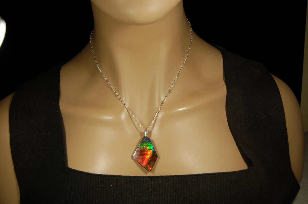 Ammolite pendant necklace.Unique raw natural cabochon with brilliant varied colors.Unisex design.Boho jewelry.031716