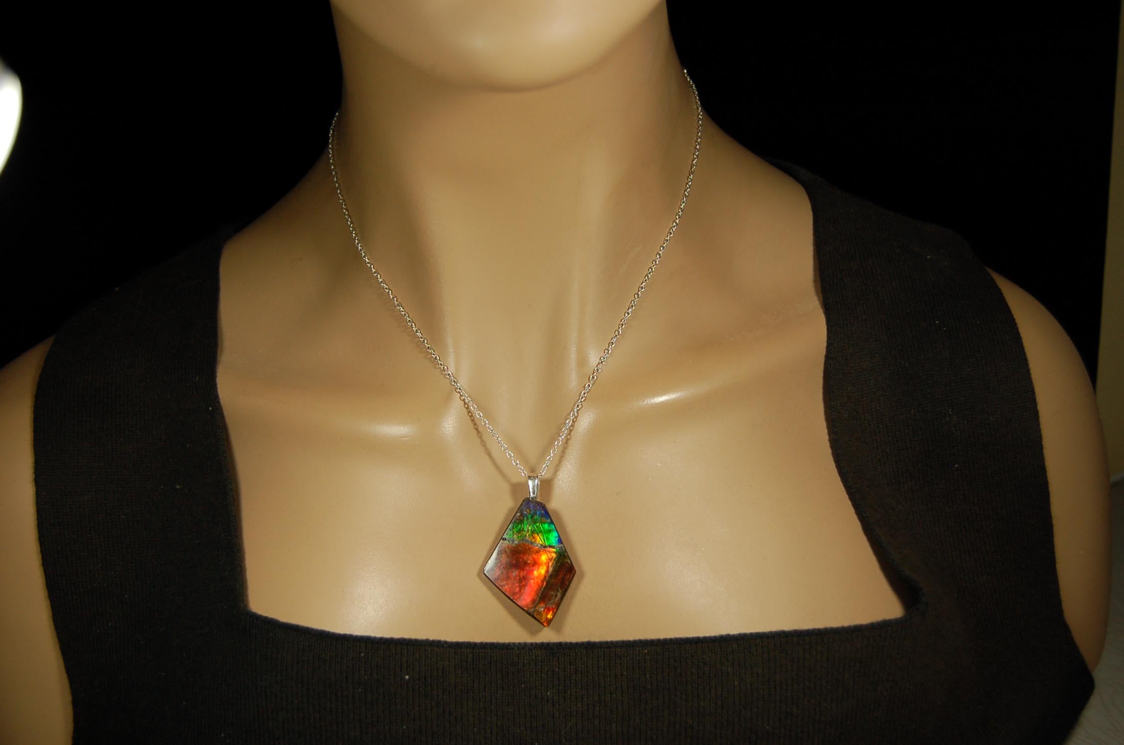Ammolite pendant necklace.Unique raw natural cabochon with brilliant varied colors.Unisex design.Boho jewelry.031716