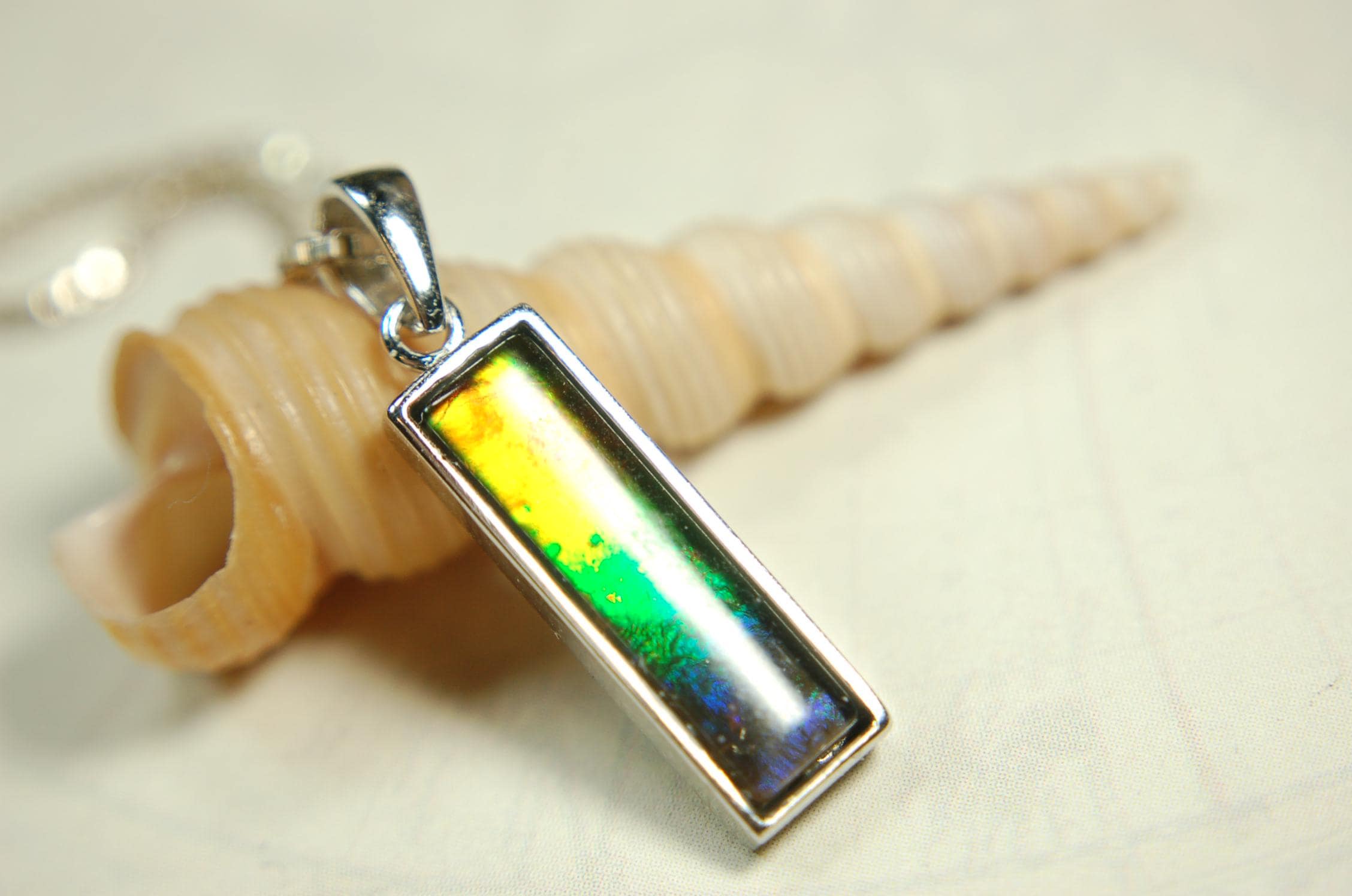 Lovely Ammolite pendant - the perfect gift for someone special.Sterling Silver plated with Rhodium so allergy free.052415