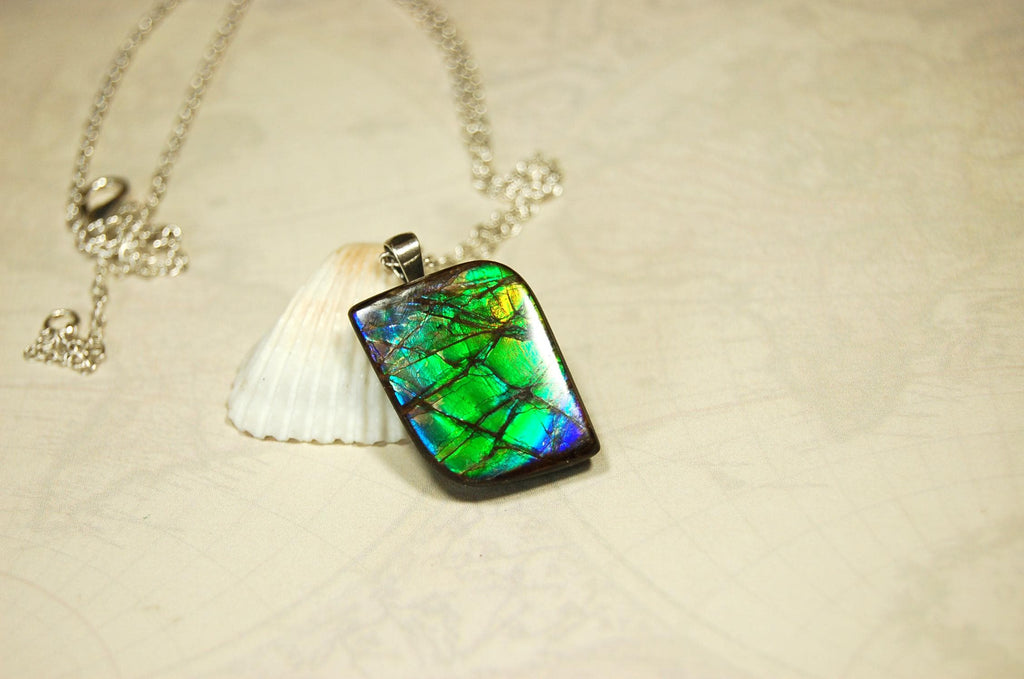 Ammolite Jewelry Pendant.Very high quality colors best seen in video.All natural cabochon gemstone from Alberta,Canada.031916
