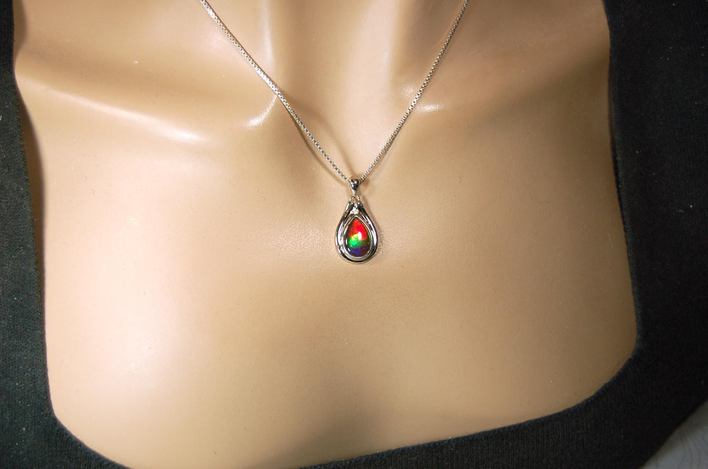 Buy Canadian Ammolite Pendant.Petite but very powerful colors.Perfect gift or gift for wife.Brilliant rainbow colors.Must see video.050429