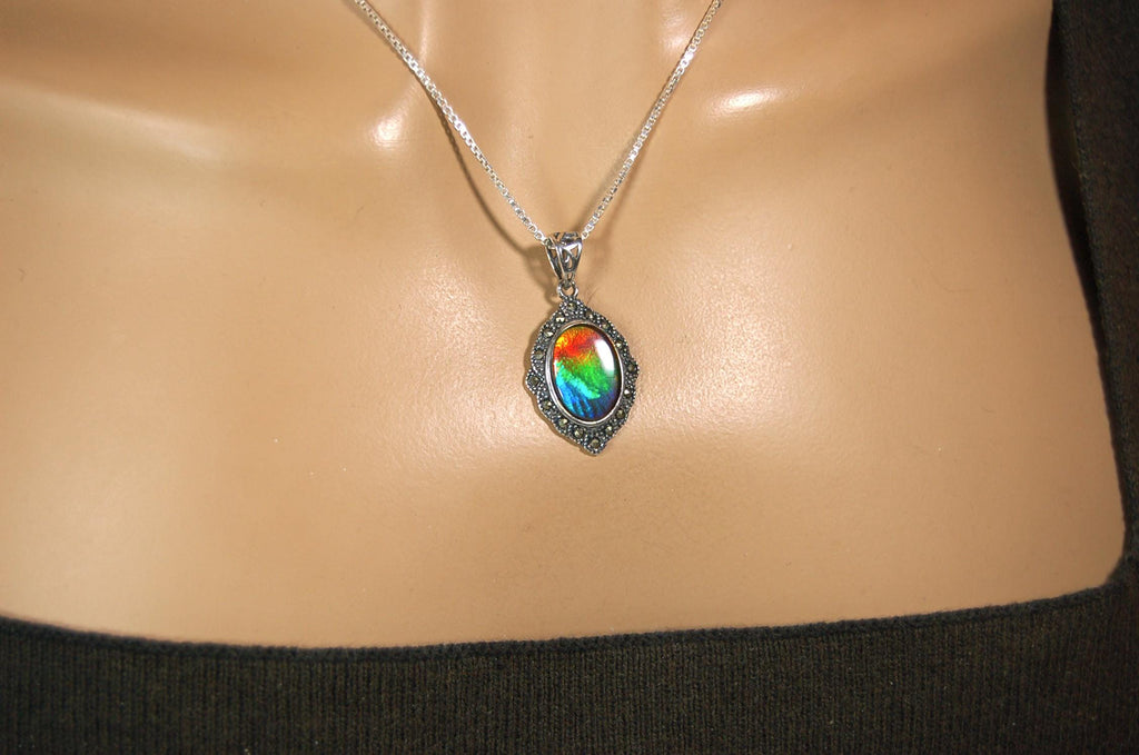 Ammolite jewelry pendant-a wifes birthgay gift Idea she will treasure.Genuine high quality ammolite mined and shipped from Canada.013115