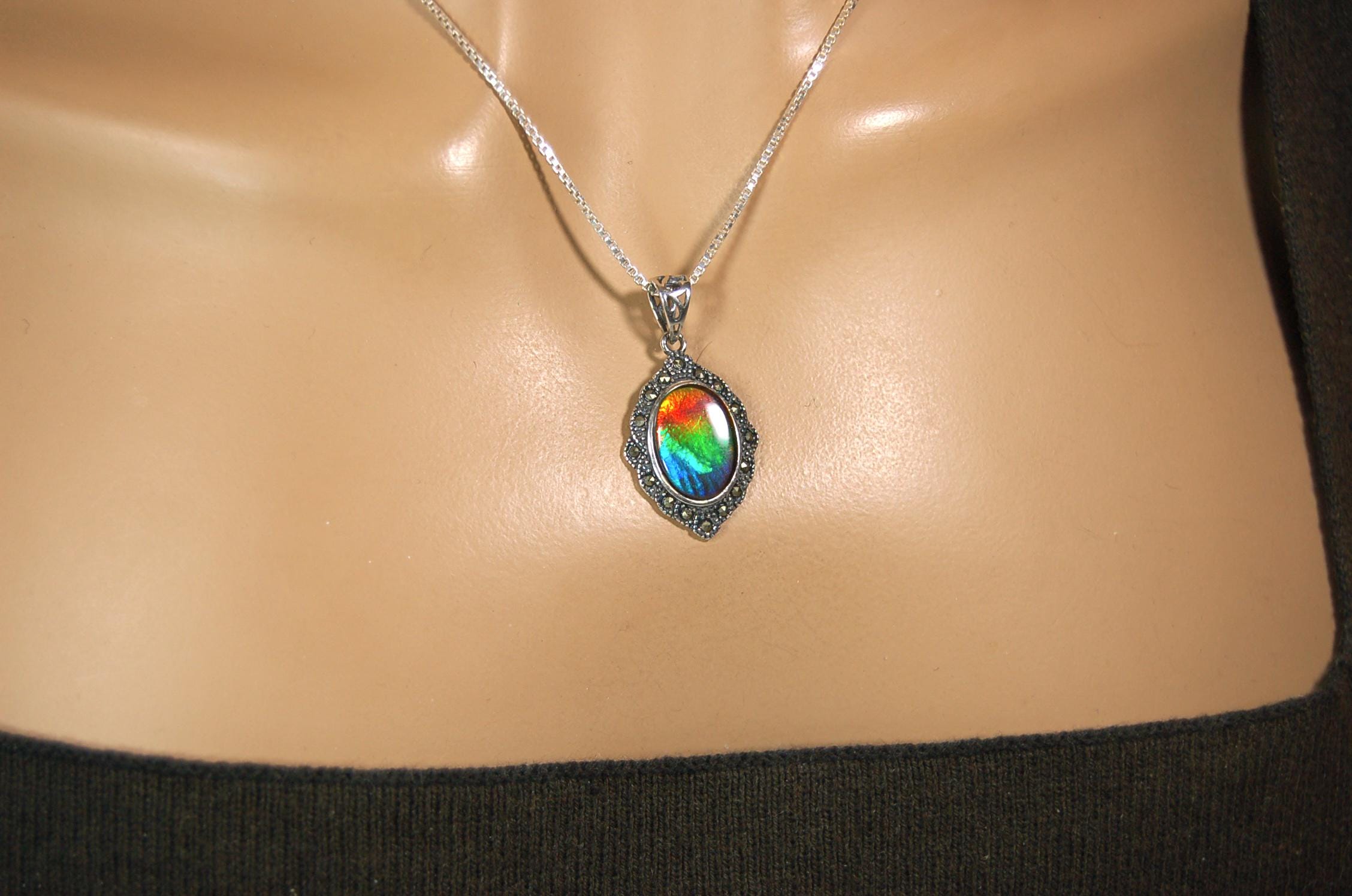 Ammolite jewelry pendant-a wifes birthgay gift Idea she will treasure.Genuine high quality ammolite mined and shipped from Canada.013115