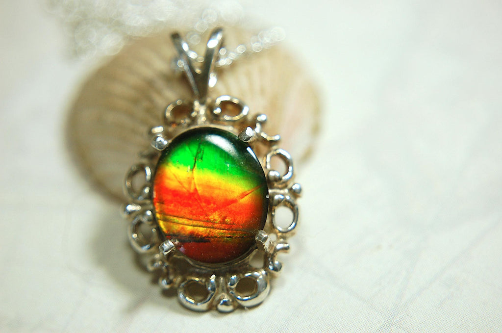 Ammolite pendant petite but powerful impact.Rich Sunset colors.Memorable gift.Fashion accessory.Rare jewelry.022216