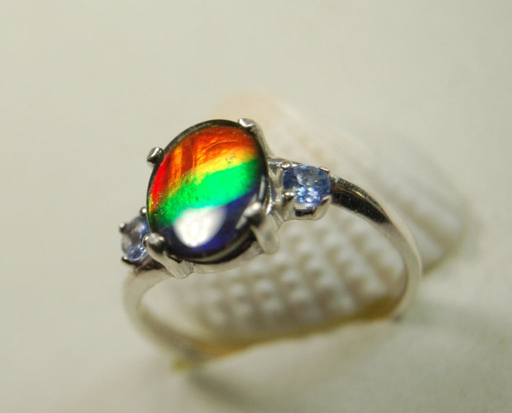 Ammolite Ring with brilliant colors and Tanzanite side stones.Size 7 #120223