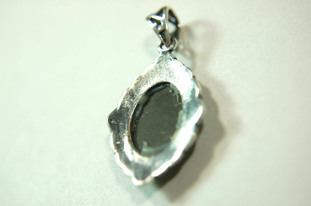 Ammolite jewelry pendant-a wifes birthgay gift Idea she will treasure.Genuine high quality ammolite mined and shipped from Canada.013115