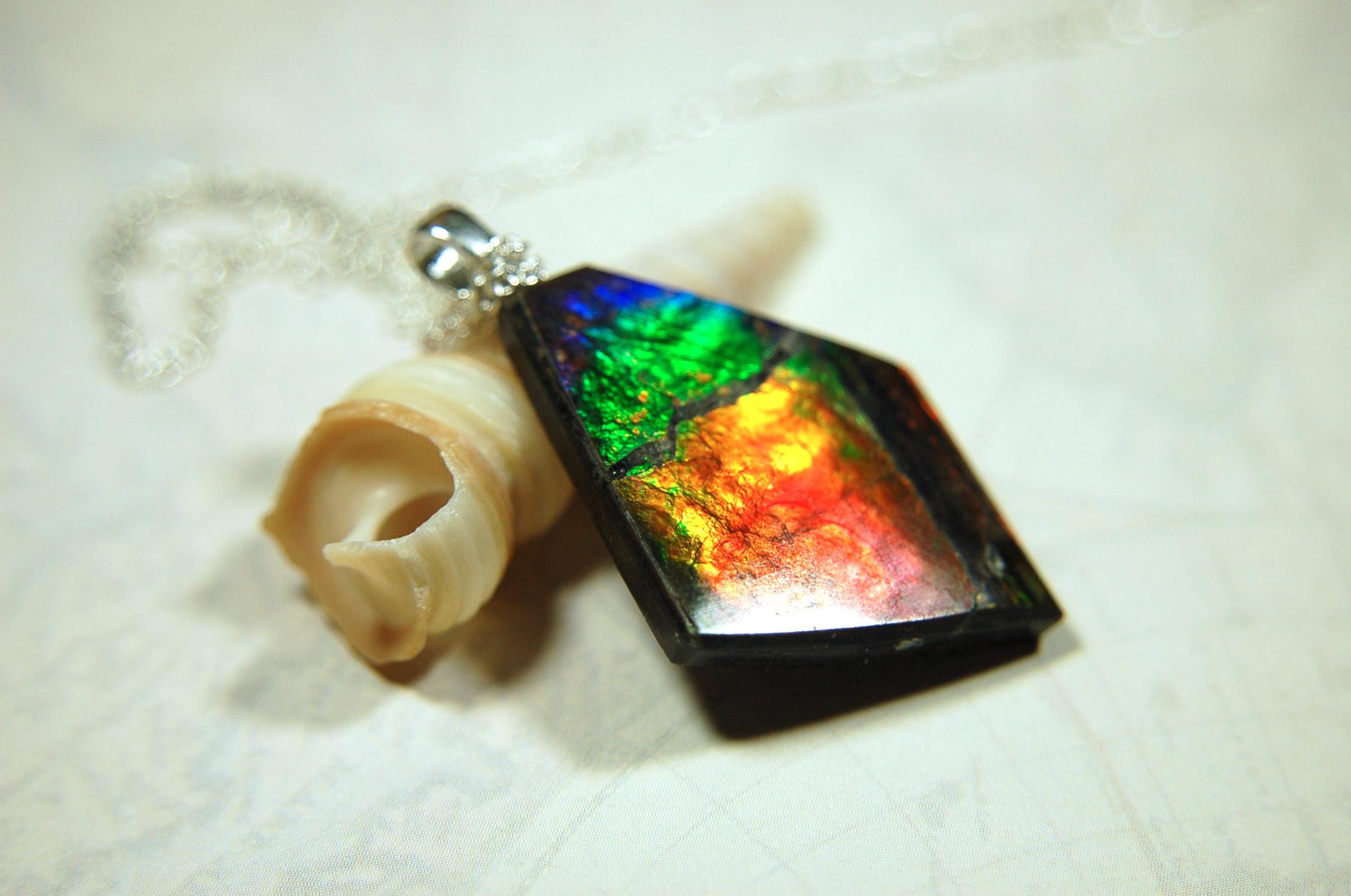 Ammolite pendant necklace.Unique raw natural cabochon with brilliant varied colors.Unisex design.Boho jewelry.031716