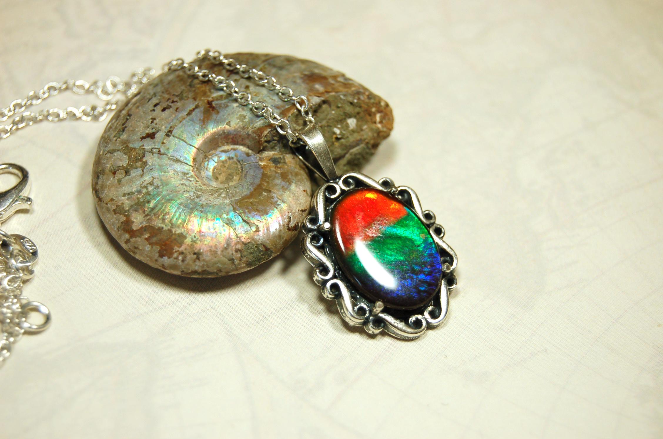Genuine Ammolite Jewelry pendant with strong rainbow colors set in solid sterling silver.High Quality fashion accessory.