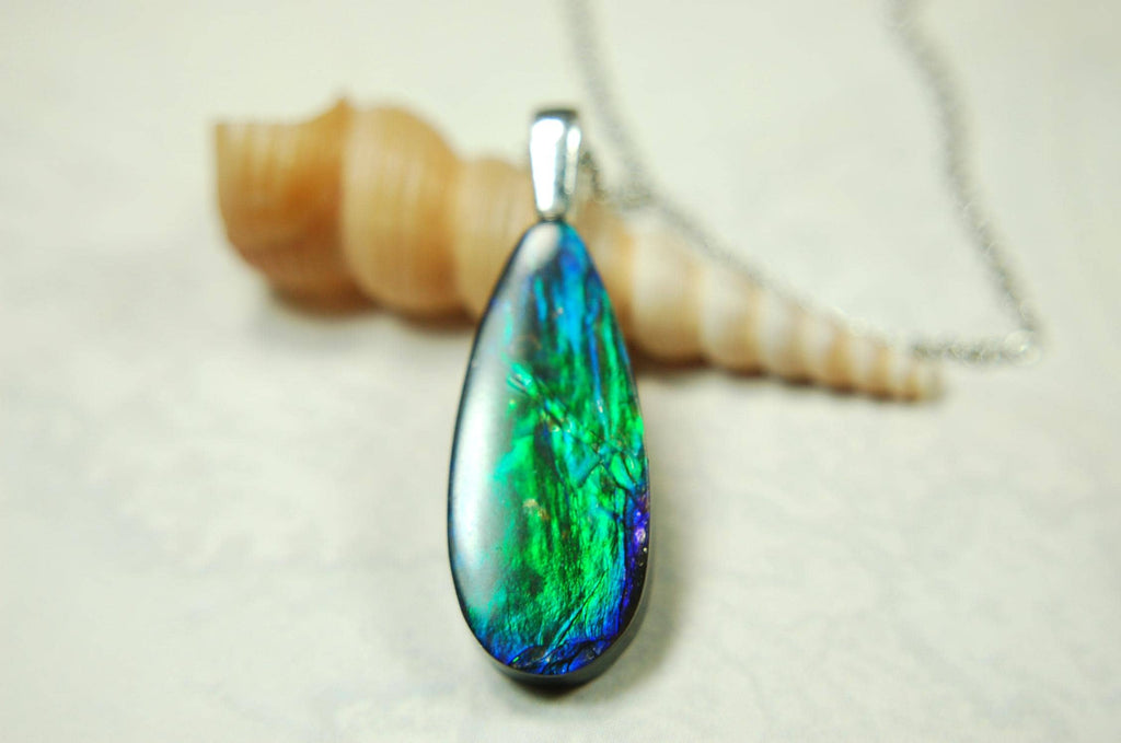 Ammolite Jewelry Pendant.All natural high quality cabochon from Alberta Canada.070715