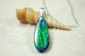 Ammolite Jewelry Pendant.All natural high quality cabochon from Alberta Canada.070715