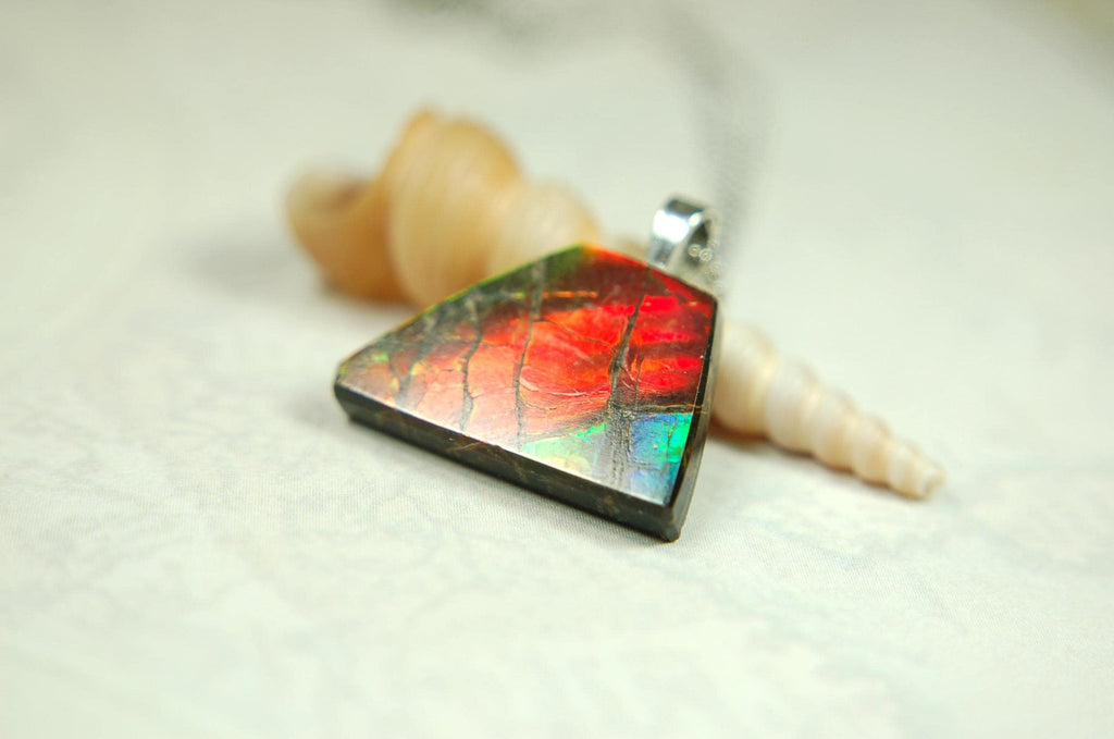 Natural Ammolite pendant with natural cabochon gem mined in Alberta Canada.070915