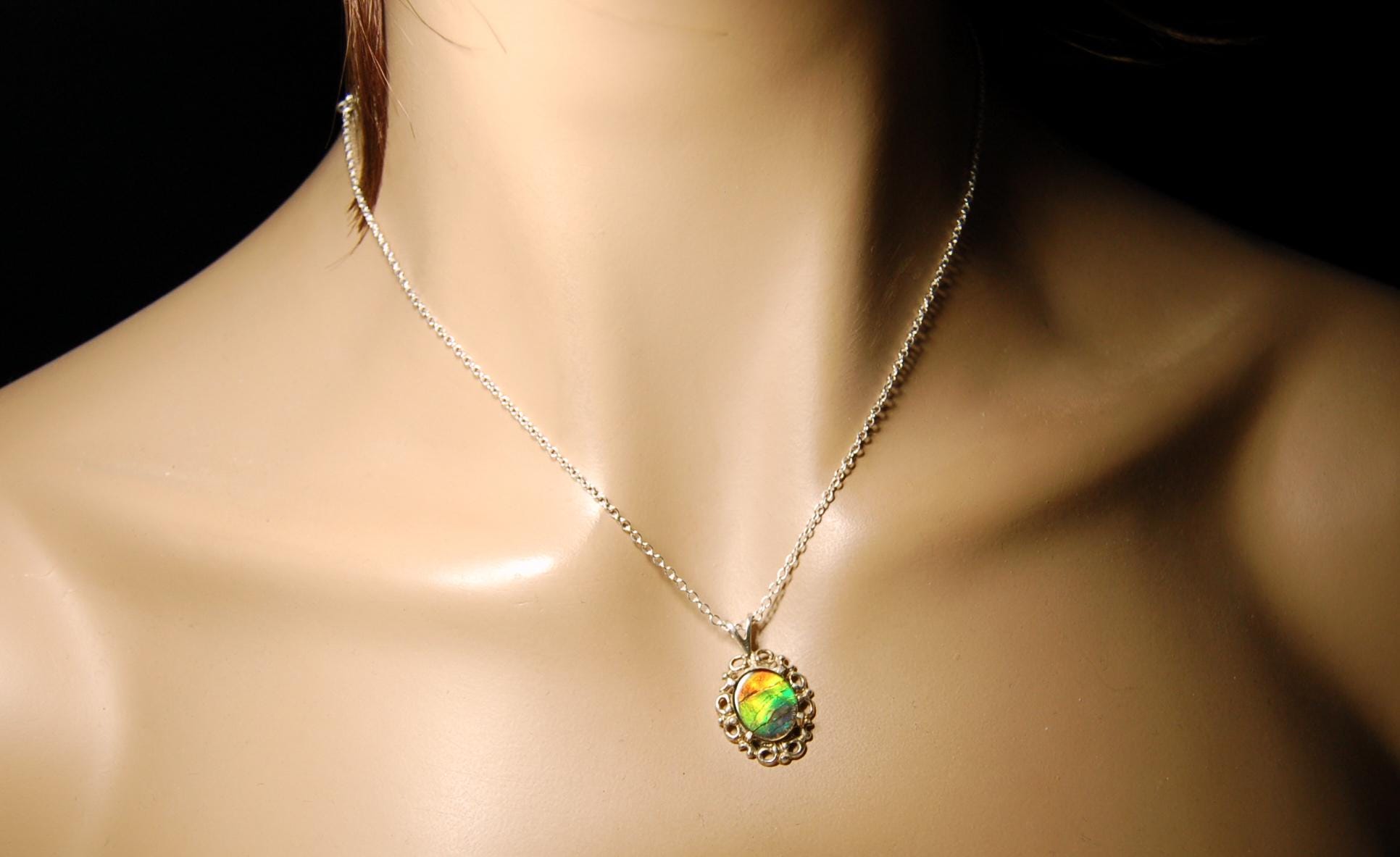 Ammolite Pendant from Alberta Canada.Genuine quality ammolite with warranty.The perfect gift.010926