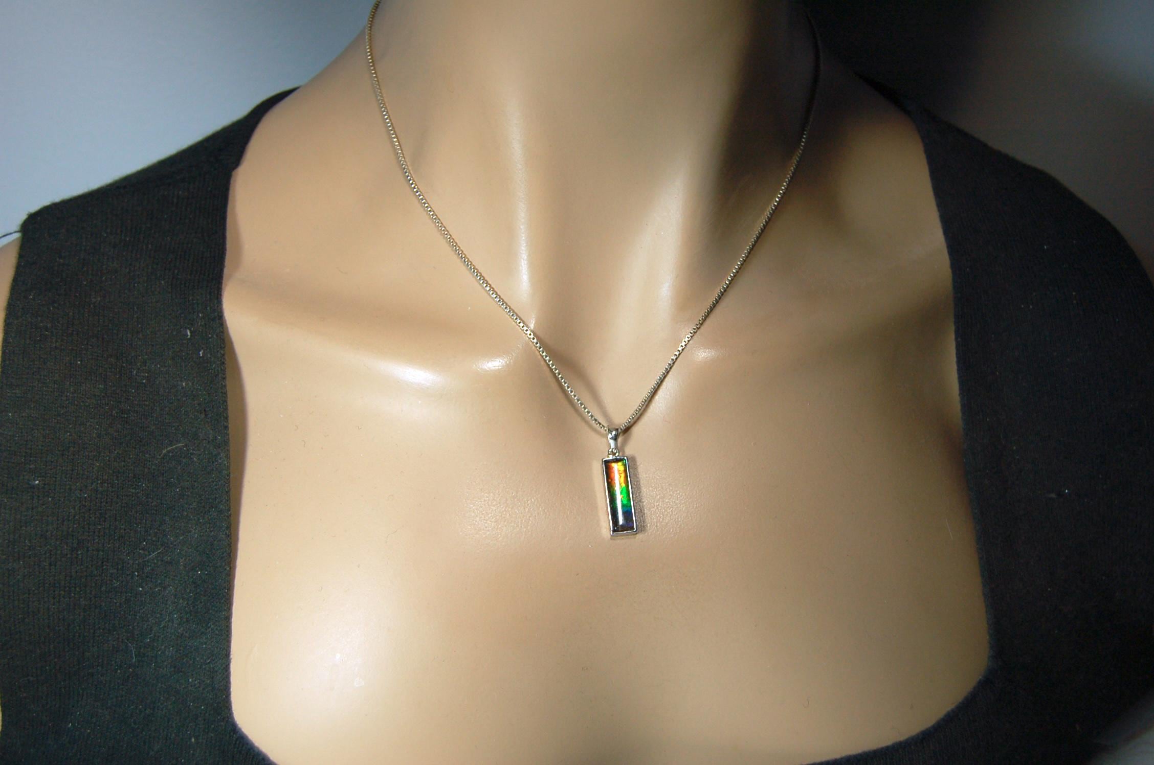 Lovely Ammolite pendant - the perfect gift for someone special.Sterling Silver plated with Rhodium so allergy free.052415
