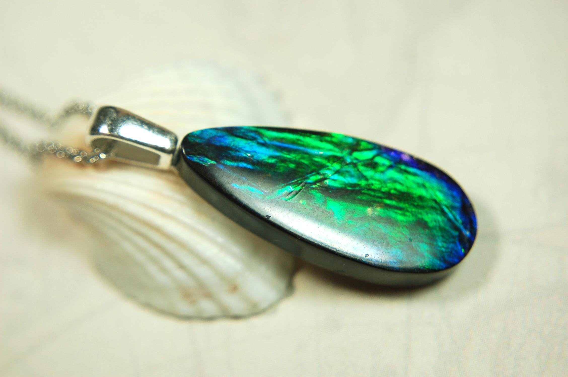 Ammolite Jewelry Pendant.All natural high quality cabochon from Alberta Canada.070715