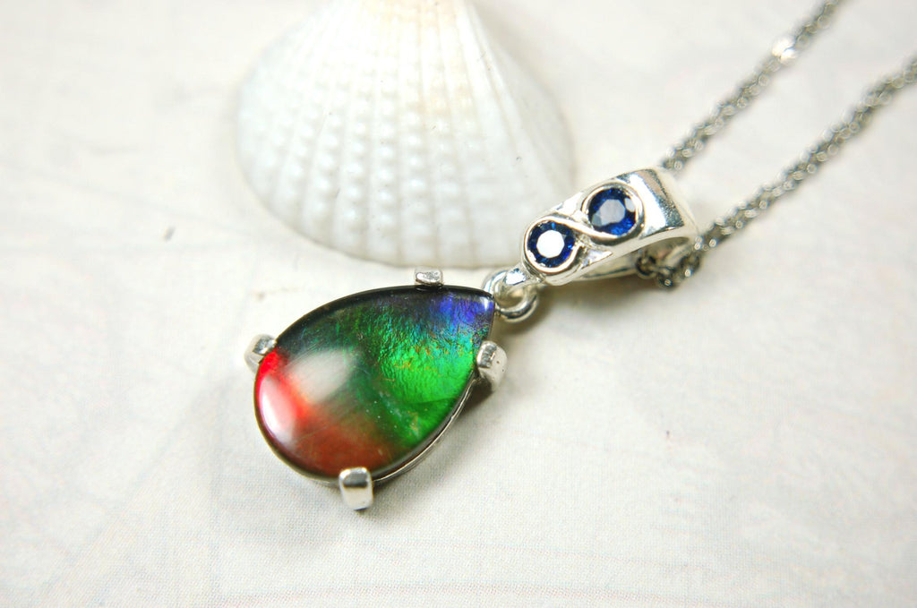 Ammolite Pendant Necklace.Sapphire studded bail.Brilliant rainbow colors.Sterling silver set.RARE gift for her.071115