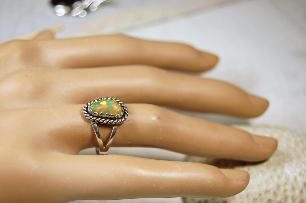 Opal Ring.Genuine untreated Ethiopian Opal.Lovely bright colors when rotated.Size 8.Sterling Silver.053115