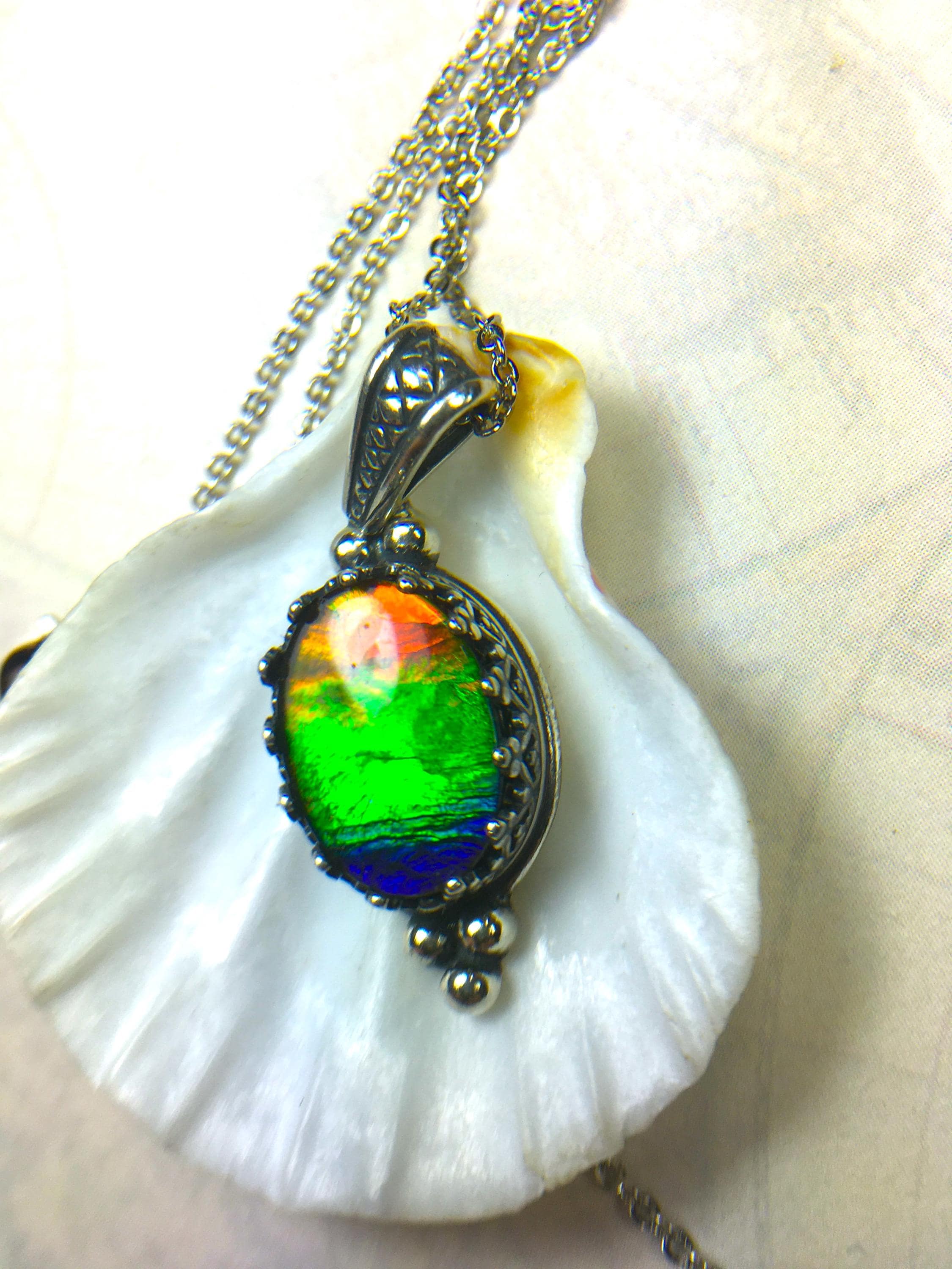 Genuine Ammolite Jewelry Pendant.Rainbow gem.Sterling Silver setting.No import taxes under CUSMA rules.062815