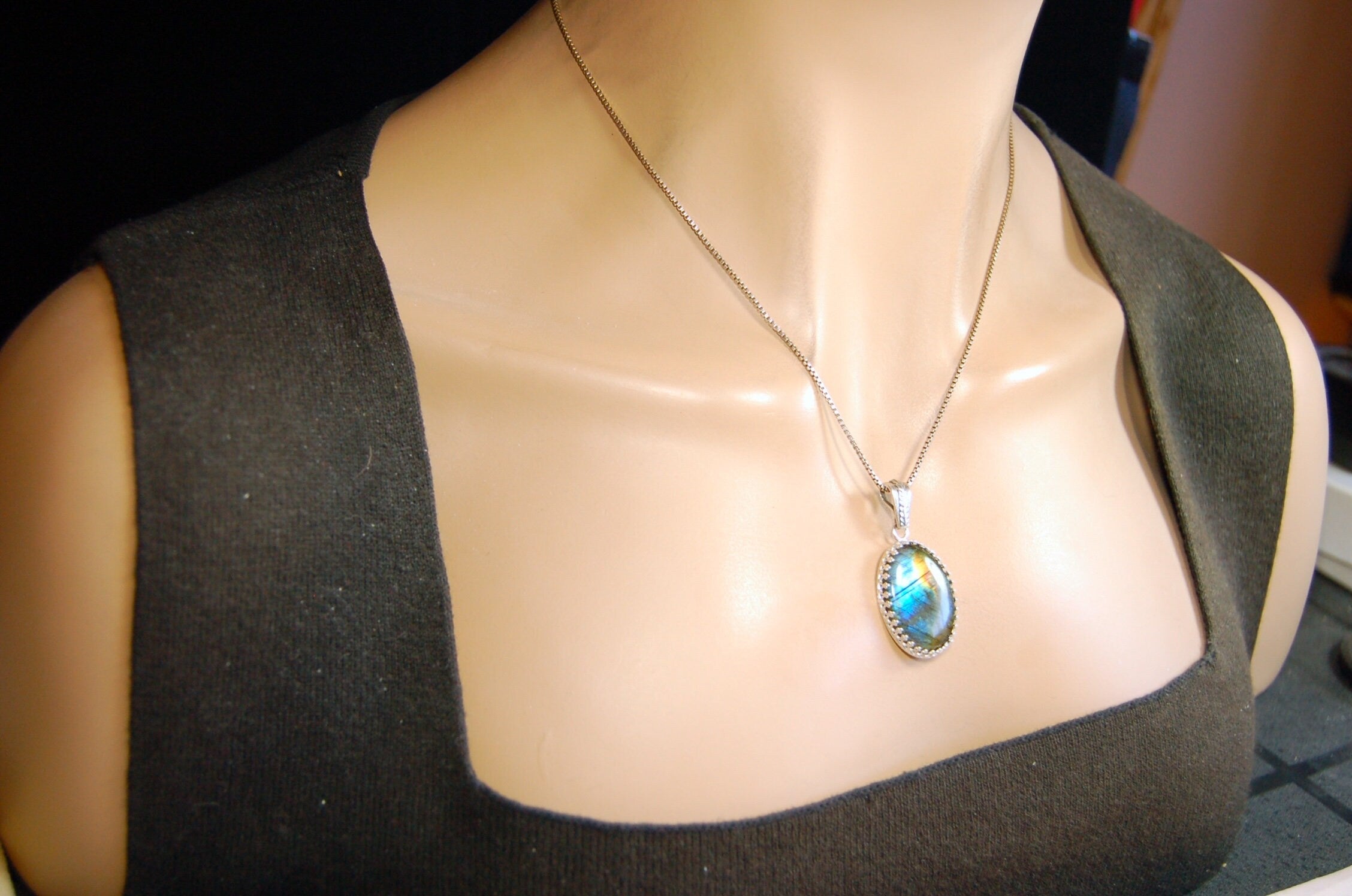 High Quality Canadian Labradorite Pendant.Lots of colored flash with blue and gold showing.The perfect gift.Unisex.033024
