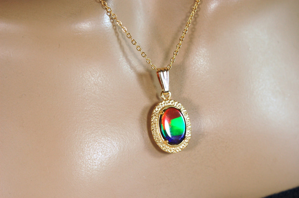 Genuine rainbow Ammolite pendant in 14k gold fill setting.#070414