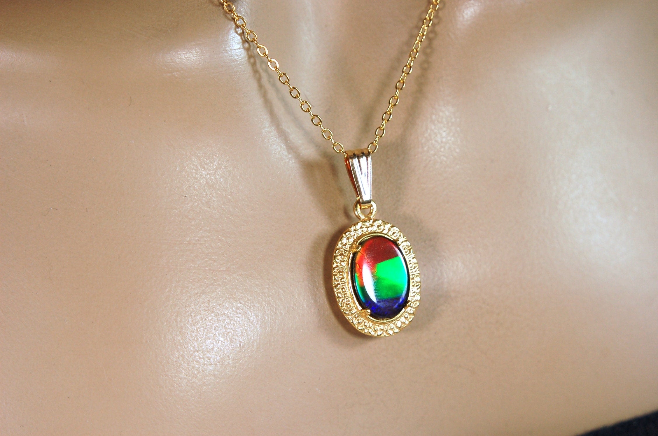 Genuine rainbow Ammolite pendant in 14k gold fill setting.#070414