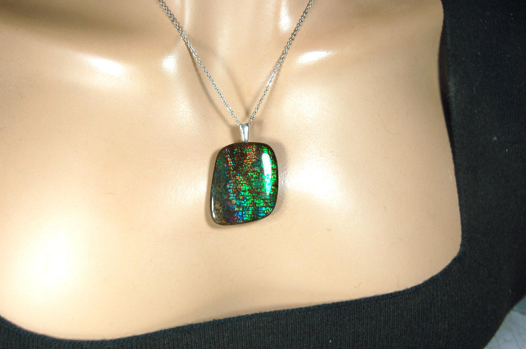 Ammolite Pendant Necklace.RARE Natural gem with brilliant sparks of color on black background.--071815