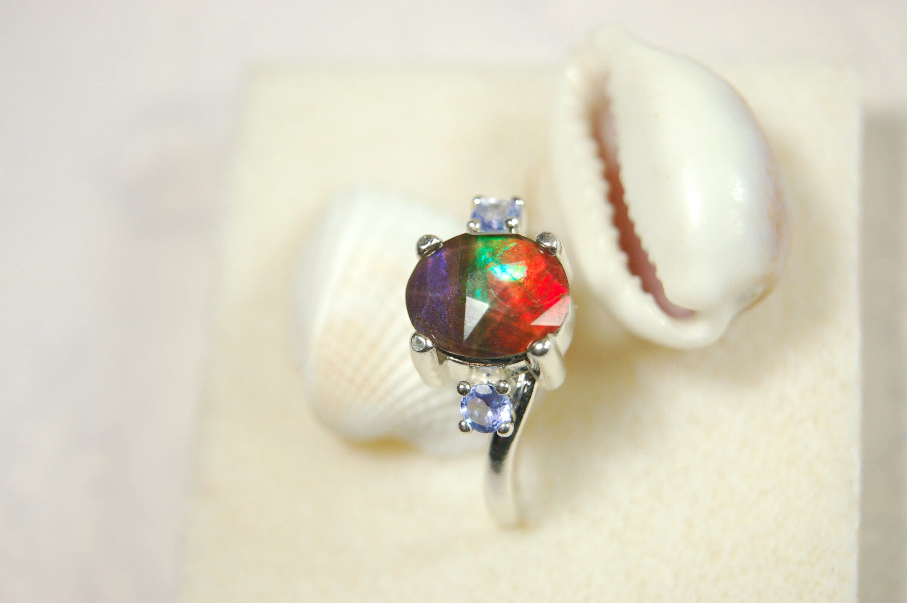 Ammolite Jewelry Ring with Tanzanites.No import taxes under CUSMA rules.022414