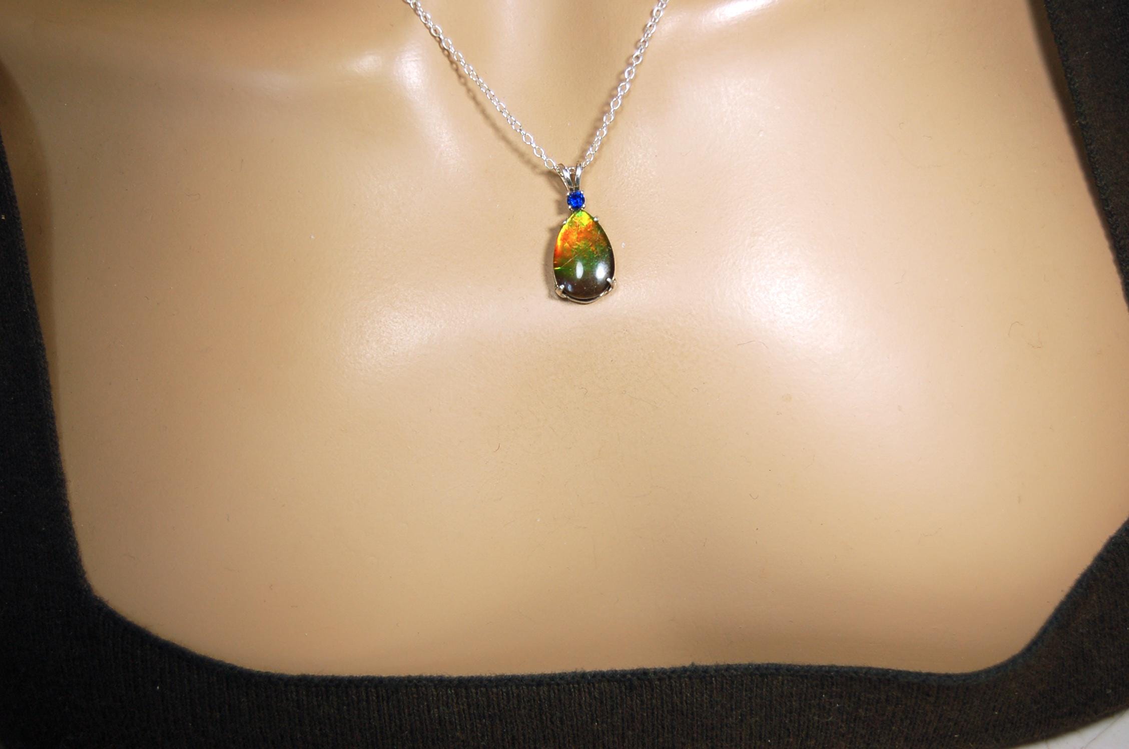 Sterling Silver set Ammolite Pendant with blue Sapphire.A gift idea for your wife she will treasure..060916