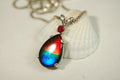 Ammolite Raibow pendant.Natural ruby companion stone.Lots of bright colors.#110317